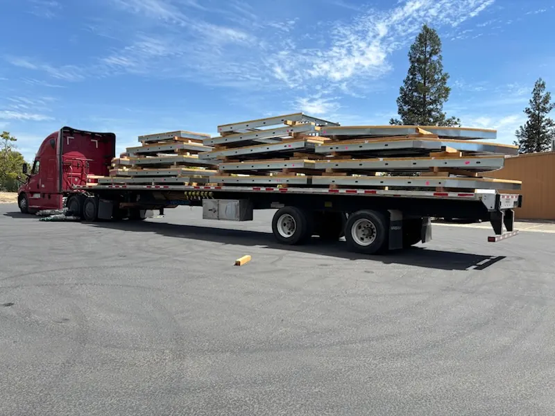 Steel framing components loaded on a flatbed trailer